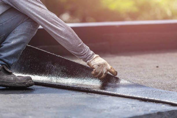 Professional Waterproofing technician working in Bay Minette, AL